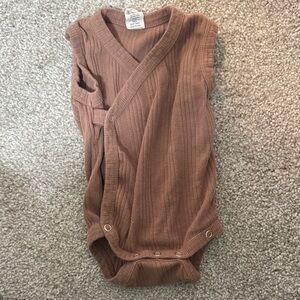 Kate Quinn Ribbed Wrap-Style Baby Onesie in Warm Brown